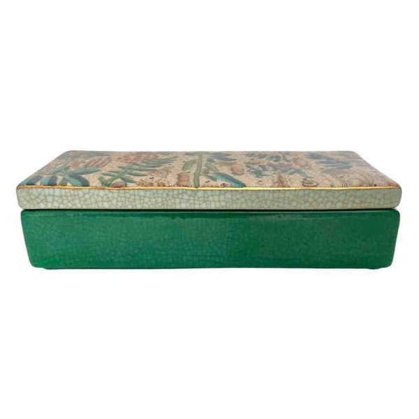 Image of rectangular porcelain trinket box with green base and multicoloured botanical theme lid.