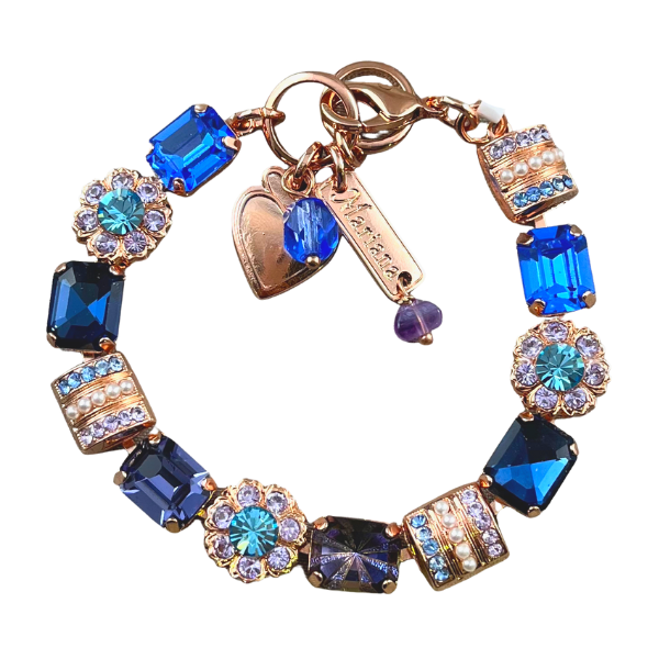 Image of Swarovski crystal bracelet using rectangle electric blue, iridized blue and lilac crystals set in 18ct rose gold plating.