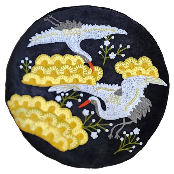 Image of black velvet ottoman cushion with Japanese crane bird embroidery.