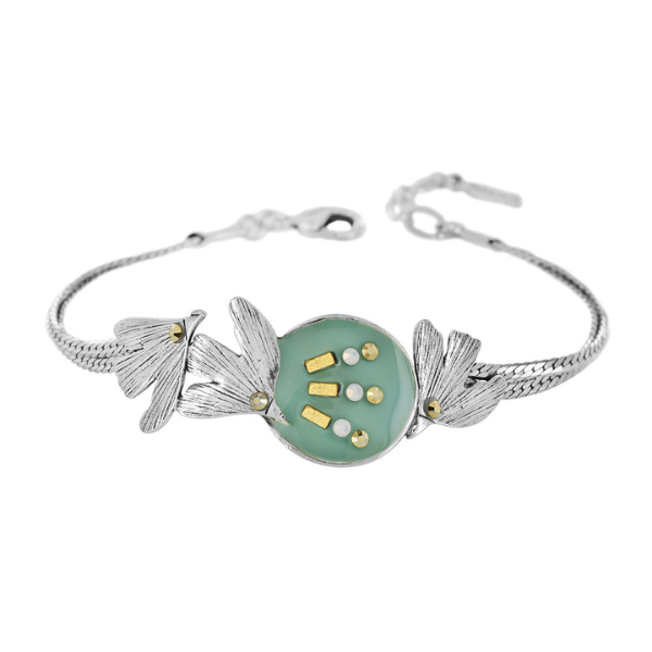 Image of pretty bracelet using birds as feature with hand painted blue resin and rhinestones on silver plated finish.