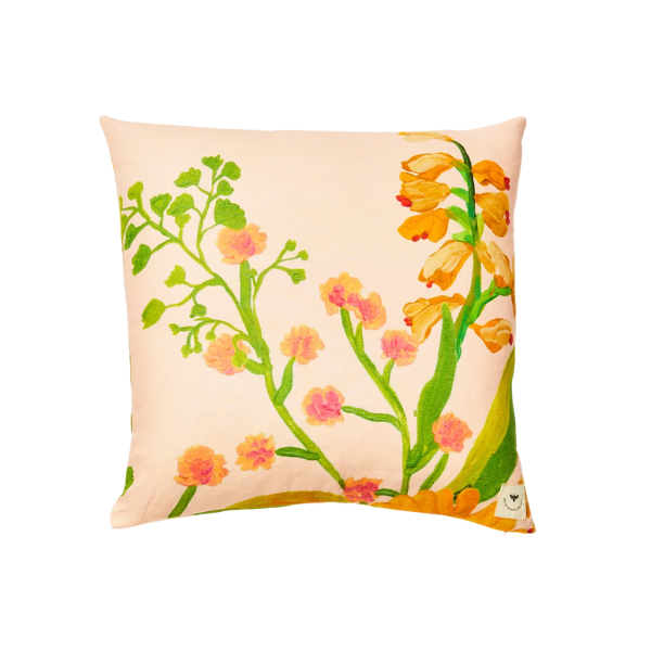 Image of 60 x 60 cm cushion with bright floral patterns on pink linen.