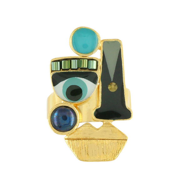 Image of gold metal ring with quirky eyes and lip feature.