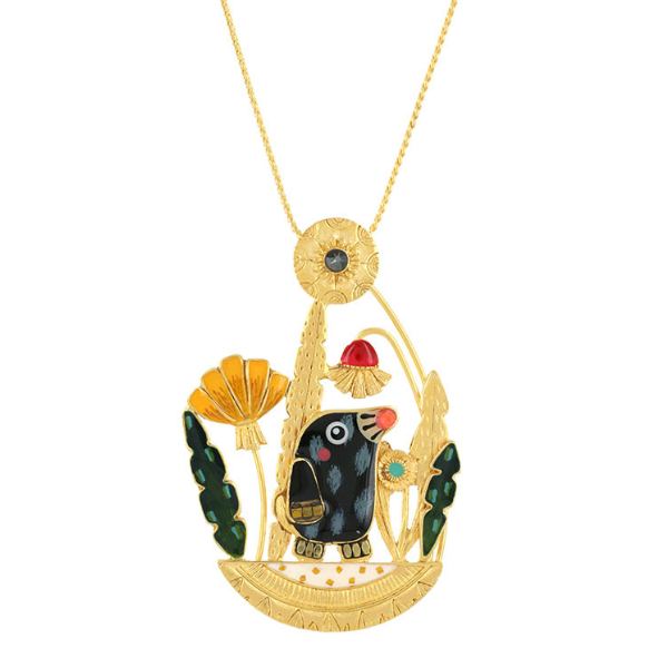 Image of large pendant necklace with pretty mole feature and foliage surrounding.