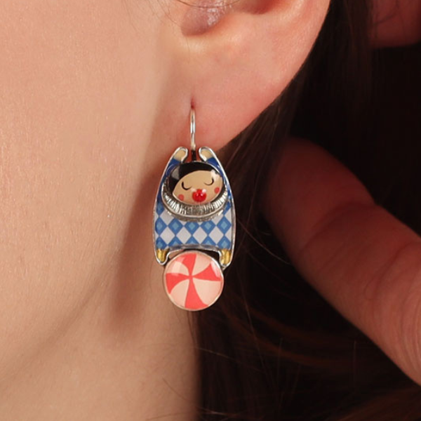 Image of model wearing colourful circus trapeze character on silver finish earrings.