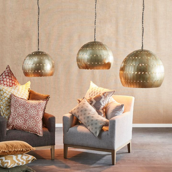 Image of styled room featuring industrial style, antique brass dome pendant light with fish scale iron.