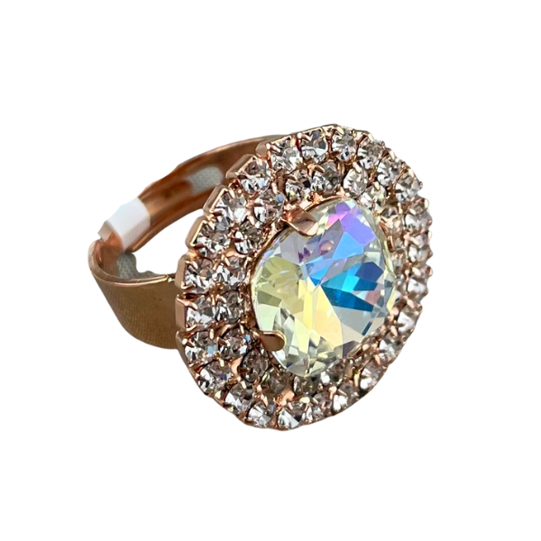 Image of large round dress ring on 18 carat rose gold using large diamond crystal centre edged with double layered diamond seed crystals.