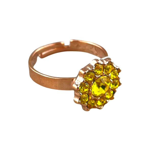 Image of adjustable flower shaped ring with yellow crystal centre surrounded by yellow seed crystals set on 18ct rose gold plated metal.