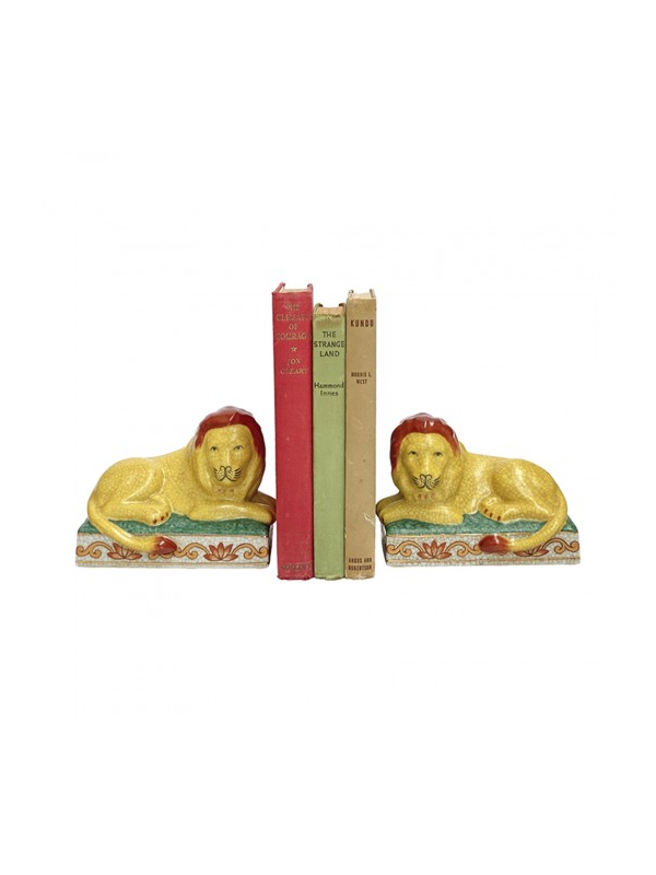 Image of lion porcelain bookends designed with golden coloured lion and rust mane .