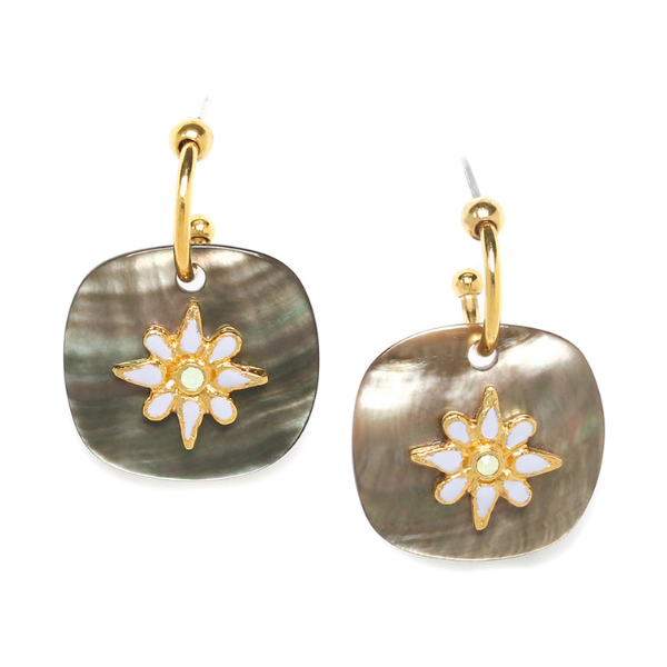Image of black lip earrings embellished with a white enamel flower on gold plated post finish.