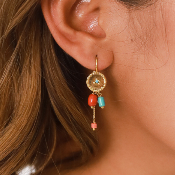 Image of model wearing ethnic style gold disc earrings with chain dangle embellished in multicoloured beads and semi precious stones on french hook.