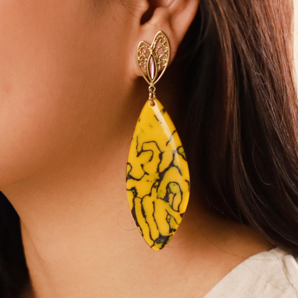 Image of large dangle earrings in termite mound citrin colour and theme on gold plated stud finish.