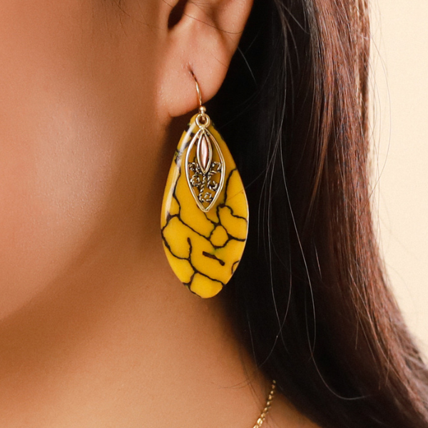 Image of dangle earrings in termite mound citrin colour and theme on gold plated hook finish.