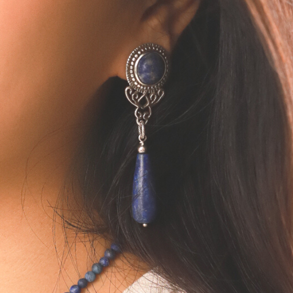 Image of model wearing pretty dangle earrings made from lapius luzil on silver stud.