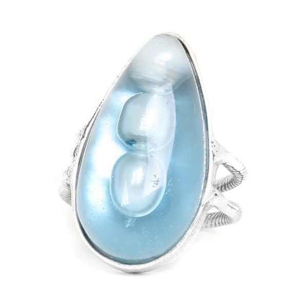 Image of teardrop shape ring with clear blue resin encrusted with pearls.