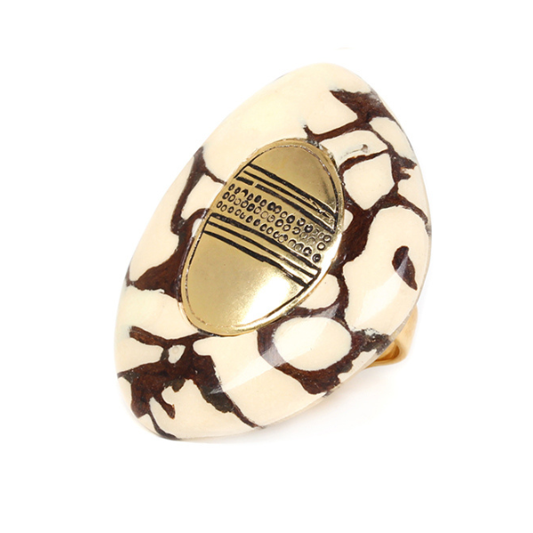 Image of ring made with termite nest and horn with antic gold metal centrepiece.