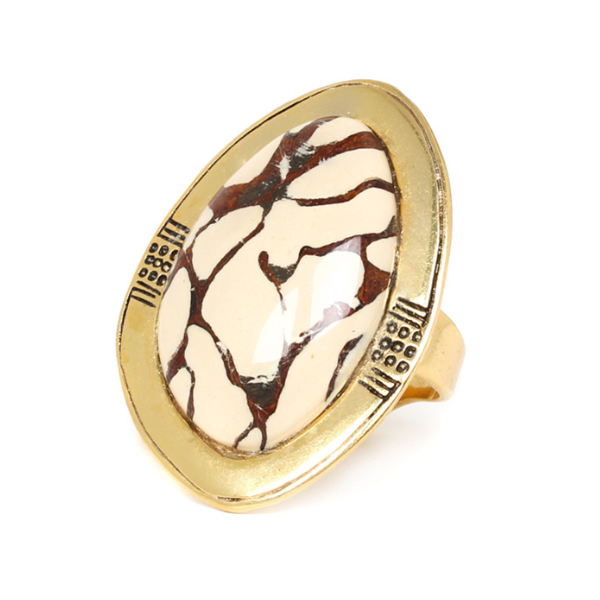 Image of ring made with termite nest and horn with antic gold metal.