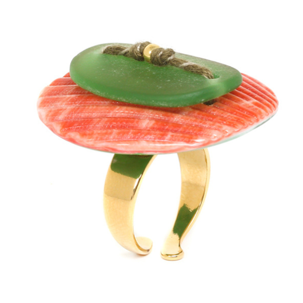 Image of large round ring with orange disc and green oval stone on top with gold plated finish.