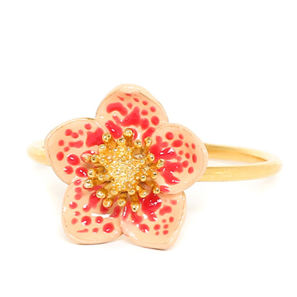 Image of pink and white hand painted flower ring on gold plated metal finish.