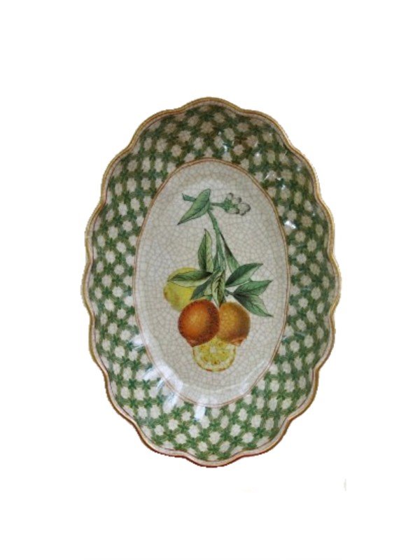 Image of a very glamorous dish, oval in shape trimmed with a scalloped, green checkered edge and gold trim. Citrus themed artwork in lemon and orange colours with green foliage. Typical of Creatively Active Minds, the procelain has a crackled finished to give the impression of age.