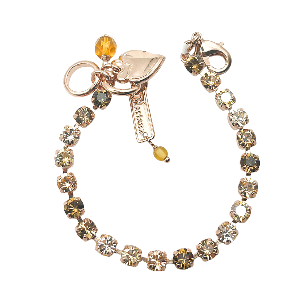 Bracelet with crystal beads and a key charm on a white background