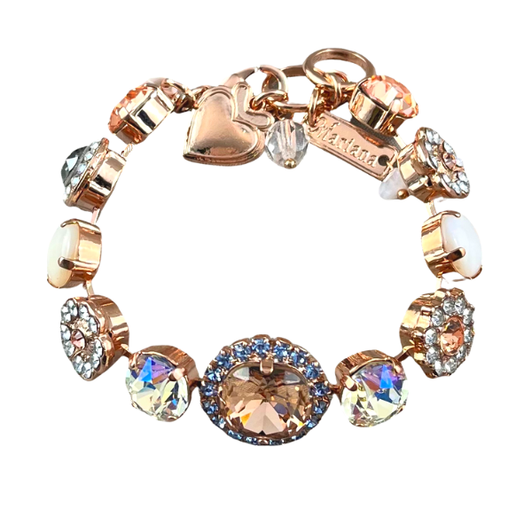 Image of elegant formal style swarovski crystal bracelet using champagne, diamond and milky crystals, and round champagne crystal as centrepiece trimmed with blue seed crystals on guilded 18ct rose gold metal.