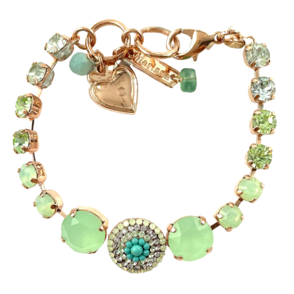 Image of jade green crystals with green and diamond encrusted flower shape centrepiece. Layered in 18ct rose gold.