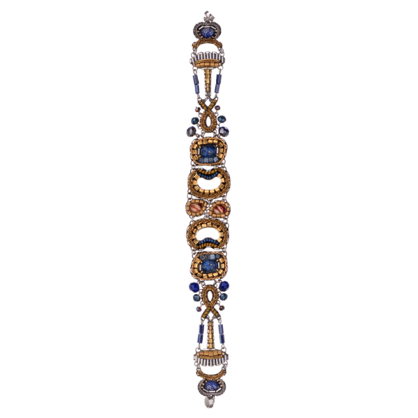 Image of magnetic clasp bracelet 100% handcrafted and contains silver plated brass and metal alloys, glass beads, ceramic stones, crystal rhinestones and fabrics in gold and blue.
