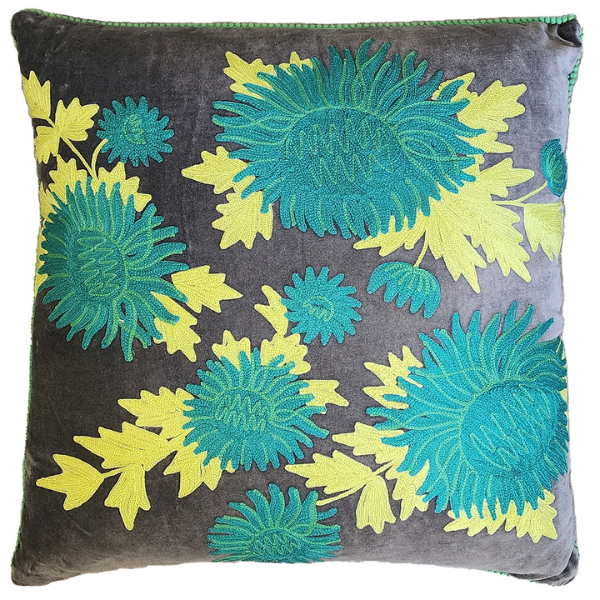 Image of charcoal velvet cushion embroidered with vibrant teal chrysanthemum and mint green foliage.