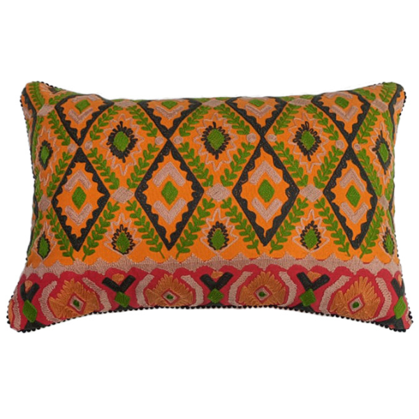 Image of cotton lumbar cushion with tribal diamonds pattern in green, red and orange embroidery.