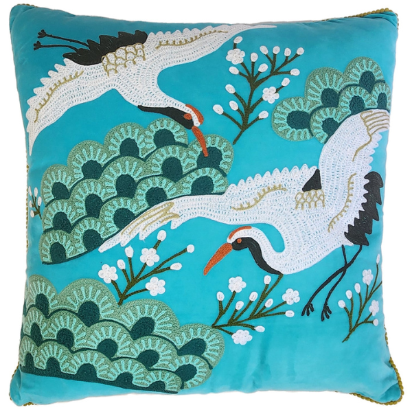 Image of aqua velvet cushion with Japanese crane bird embroidery.