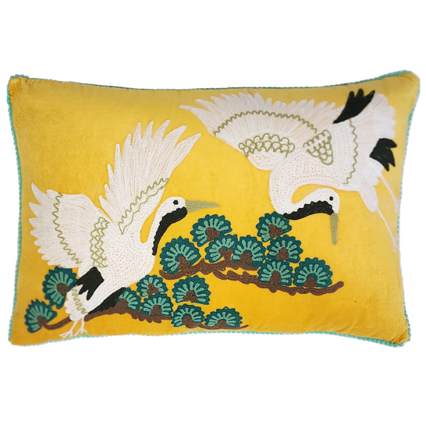 Image of yellow velvet lumbar cushion with Japanese crane bird embroidery.