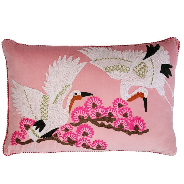 Image of pink velvet lumbar cushion with Japanese crane bird embroidery.