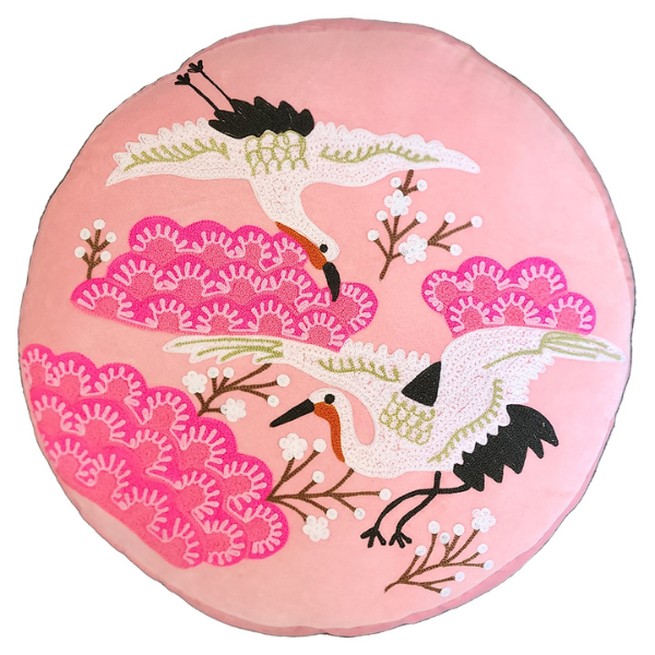 Image of pink velvet ottoman cushion with Japanese crane bird embroidery.