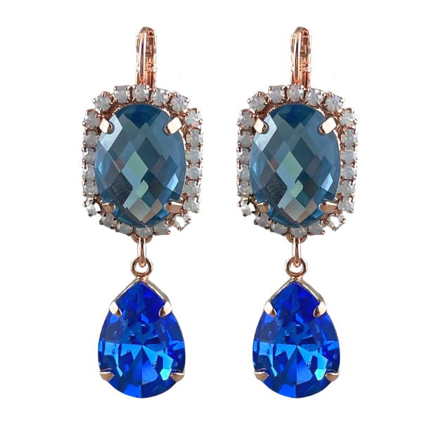 Image of navy, oval crystal earrings trimmed with milky white crystals, and adorned with a vibrant blue teardrop crystal set underneath.