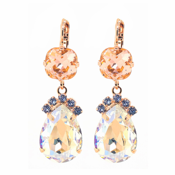 Image of earrings with clear teardrop crystal dangle encrusted with blue seed crystals on top and champagne square crystal above on 18 carat gold finish.