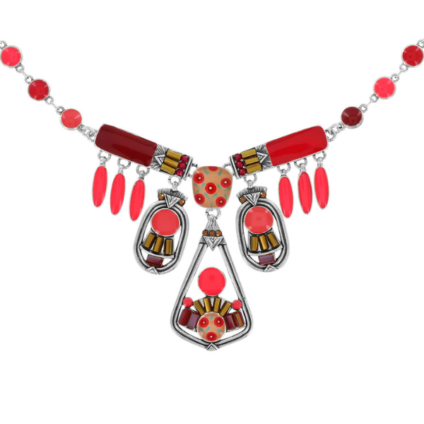 Image of statement necklace with multiple hand painted motifs in many shades of pink on silver metal finish.