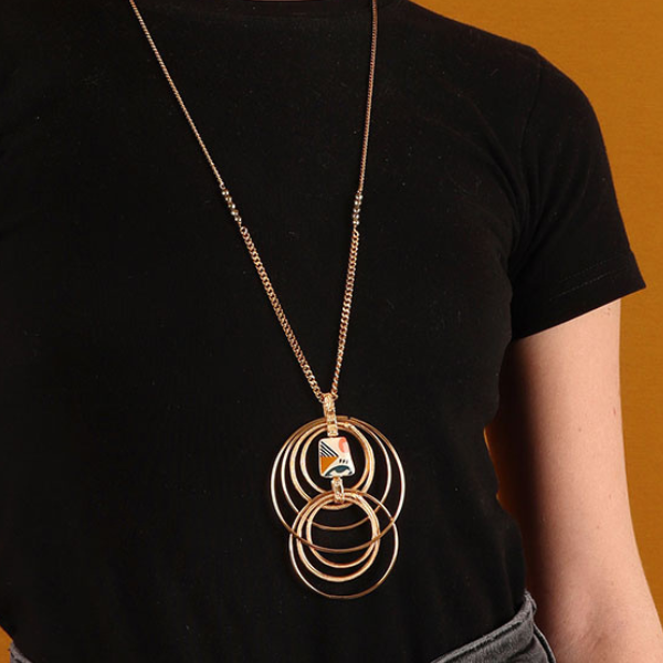 Image of model wearing long multi ring necklace, chain embellished in beads and hand painted motif on golden metal finish.