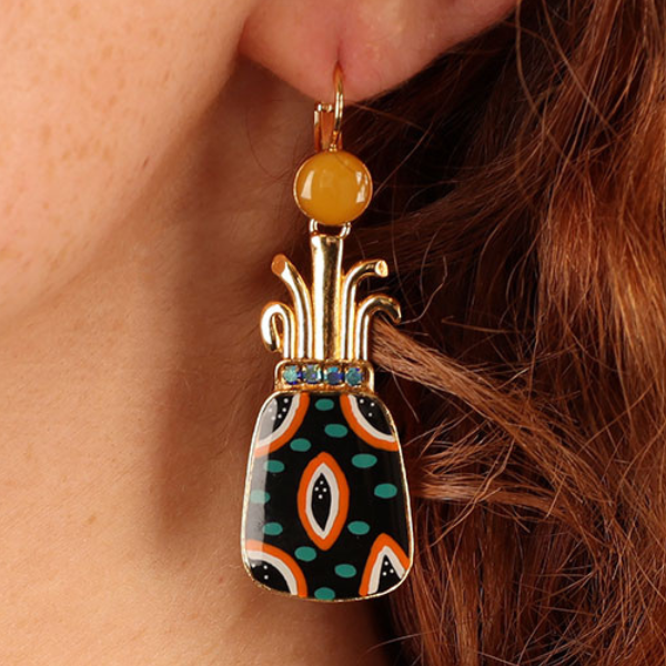 Image of model wearing quirky french hook earrings in the shape of pineapple hand painted multicolours on gold metal finish.