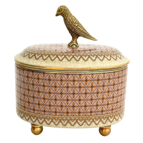 Pretty bird feature lid, oval shaped trinket box with brass detail and pink colours.
