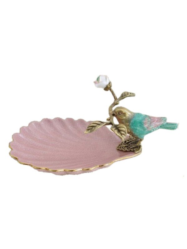 Image of an outstanding decorative item that has been created using porcelain and brass. Shell shaped dish glazed pink with green and bird holding a brass twig with white flower bud.