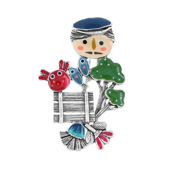 Image of brooch with character Leon Gherkin carrying market produce.