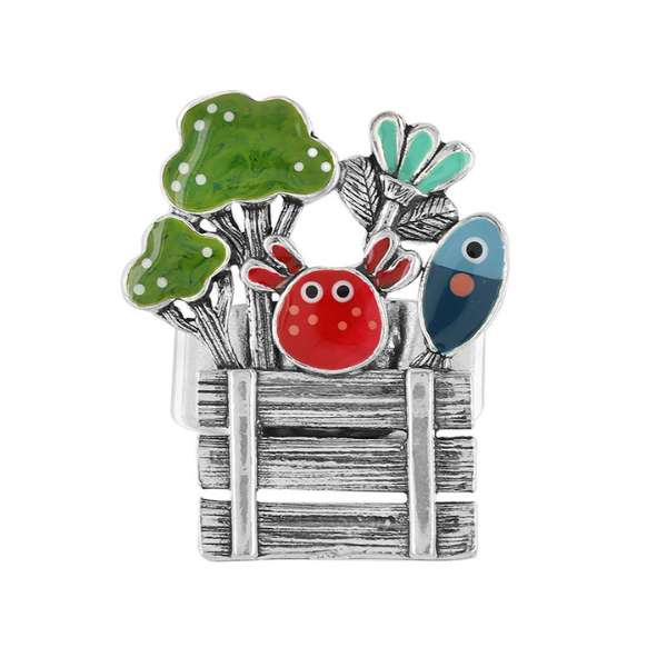 Image of quirky silver metal ring with market produce hand painted features.