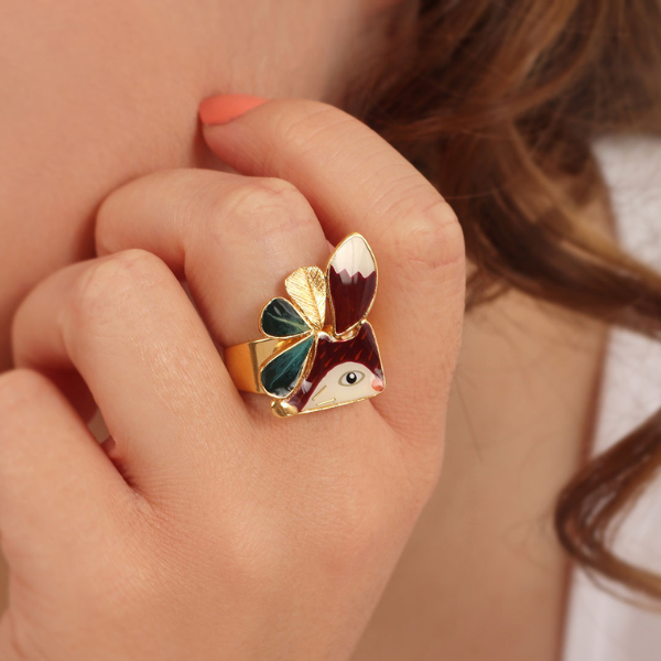 Image of model wearing fox ring on gold plated finish.