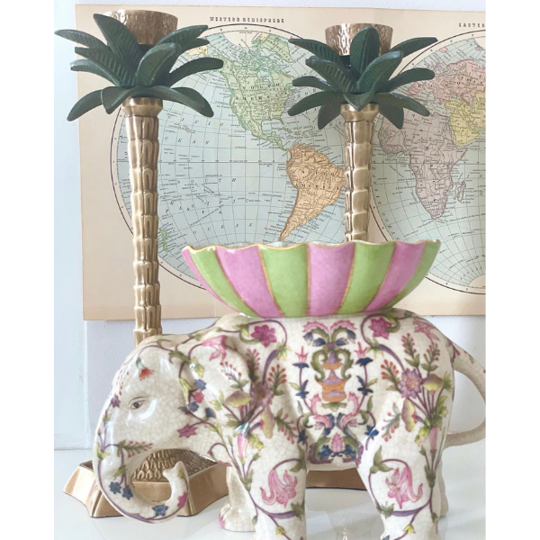 Always exquisite in design are the products from Creatively Active Minds.  This ornamental elephant has been decorated with pink flowers and has a green and pink stripe dish on top.