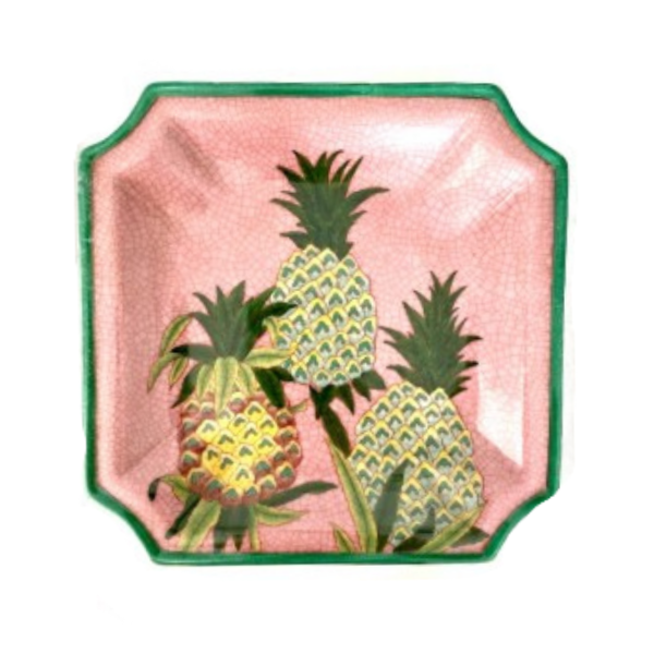 As pretty as a picture is this three pineapple motif on a square ceramic plate that overlays a pink background with green edging.  This piece has been designed as a wall plate or lay flat as a stunning decor item.