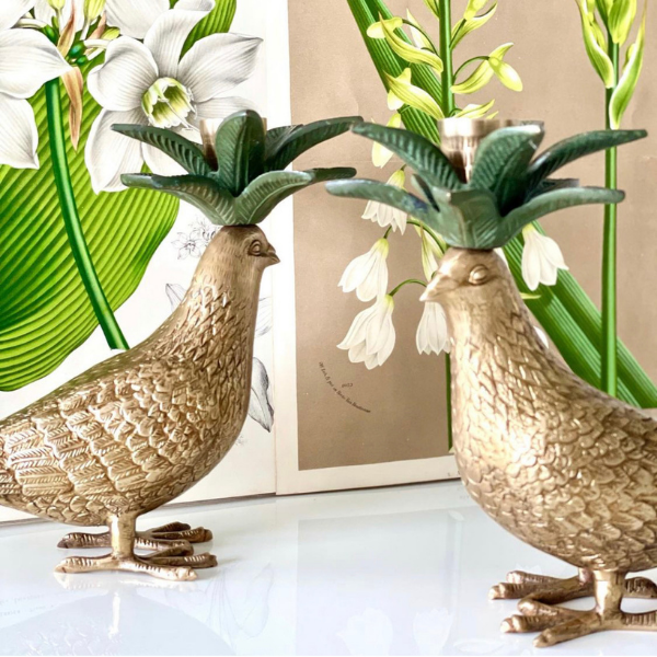 Statuesque brass dove candle holders formed from brass.  Verde green brass leaves sit atop this dove.  How impressive would be a pair sitting on your dining table?
