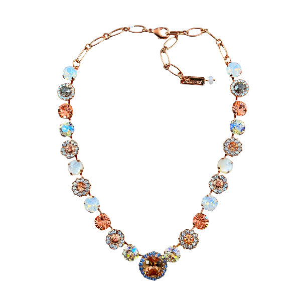 Image of elegant formal style swarovski crystal necklace using champagne, diamond and milky crystals, and round champagne crystal as centrepiece trimmed with blue seed crystals on guilded 18ct rose gold metal.