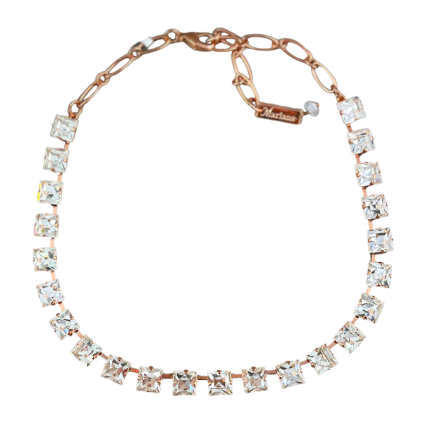 Image of elegant swarovski crystal necklace using square diamond crystals to embellish the neckline on gilded 18ct rose gold metal.