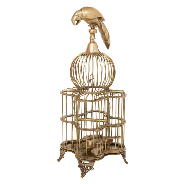 Image of brass cage candle holder with bird perched on top.