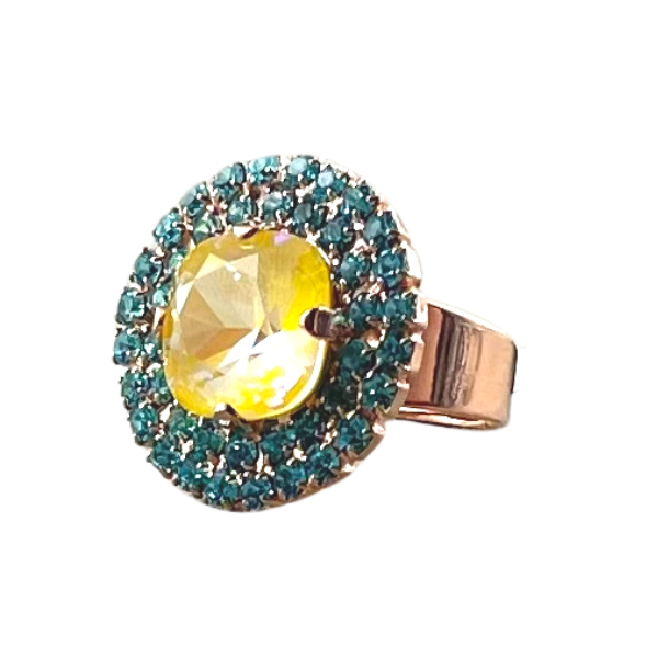 Image of crystal encrusted dress ring with yellow square centrepiece layered with two rows of small aqua crystals.